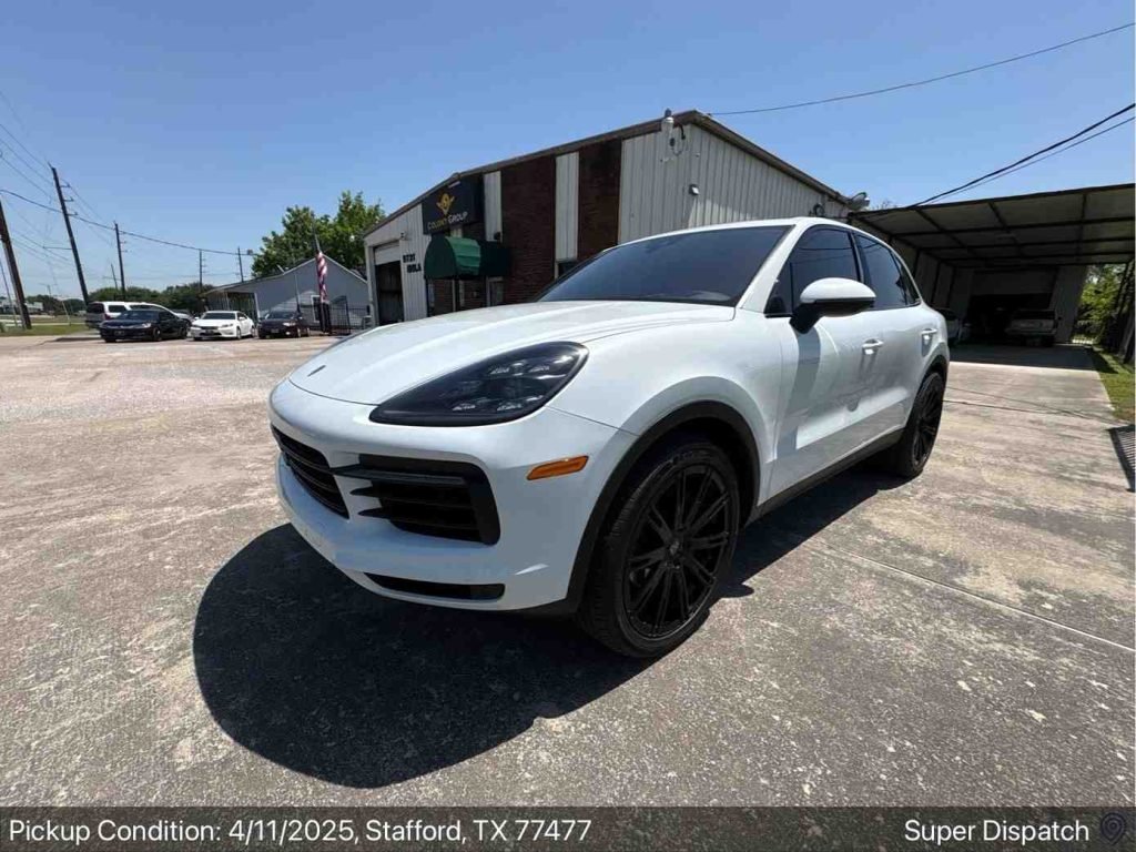 This is image shows a white car read to ship from stafoord texas by nexgen auto transport team